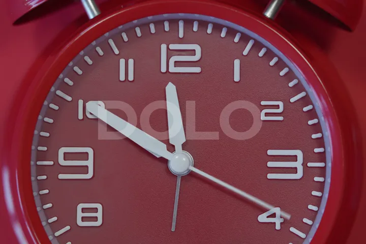 Red Analog Clock Face in Close-Up
