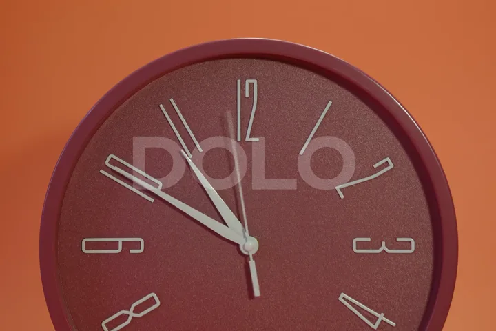 Red Analog Clock Timelapse on an Orange Background