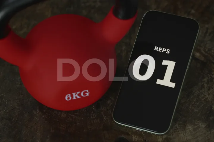 Workout Repetition Counter Beside a Red Kettlebell