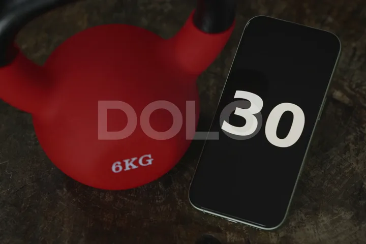 Workout Timer Counting from 1 to 30 Beside a Kettlebell